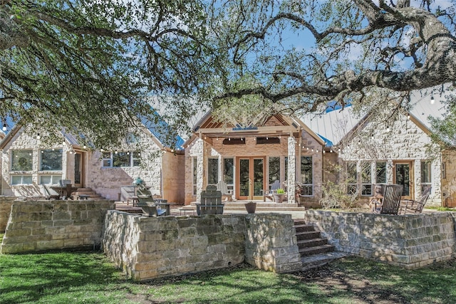 back of house featuring french doors