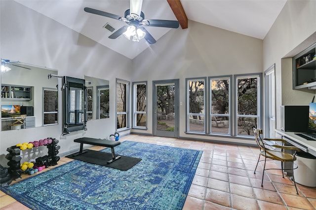 workout area featuring ceiling fan and high vaulted ceiling