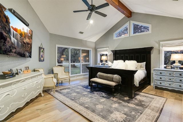 bedroom with vaulted ceiling with beams, ceiling fan, and light wood-type flooring