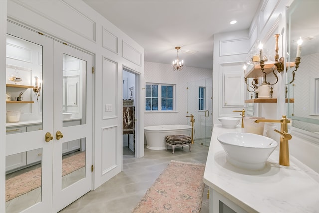 bathroom featuring vanity, plus walk in shower, french doors, tile patterned floors, and a notable chandelier