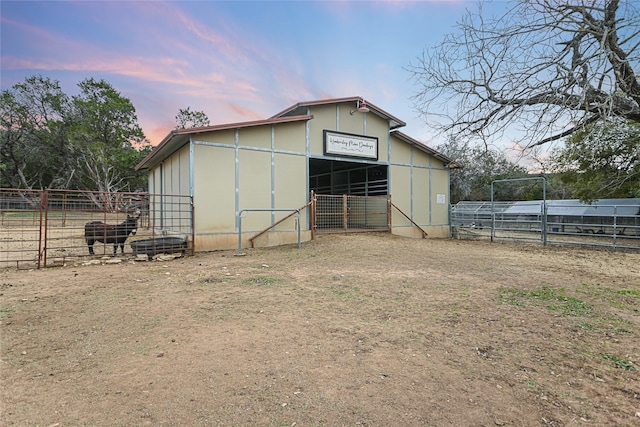 view of outdoor structure at dusk