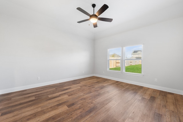 empty room with ceiling fan and hardwood / wood-style floors