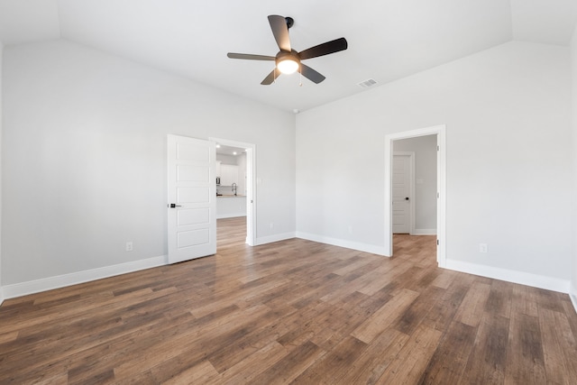 unfurnished bedroom with vaulted ceiling, ceiling fan, and dark hardwood / wood-style floors