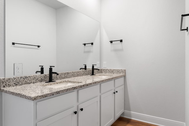 bathroom featuring hardwood / wood-style floors and vanity