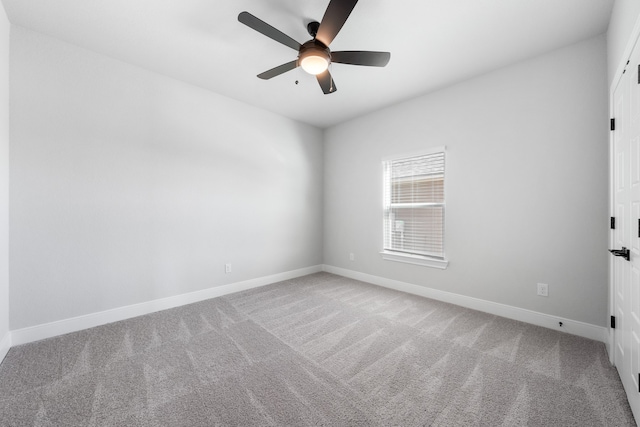 empty room with carpet and ceiling fan