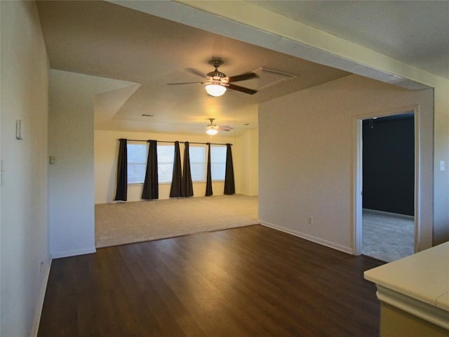 unfurnished room with dark wood-type flooring and ceiling fan