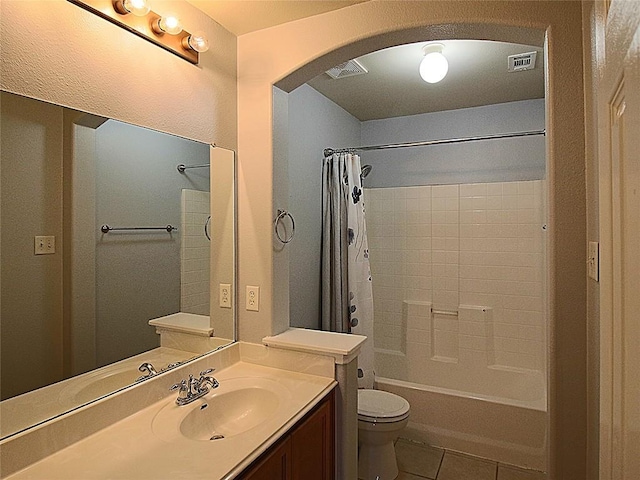 full bathroom with shower / tub combo with curtain, tile patterned floors, toilet, and vanity