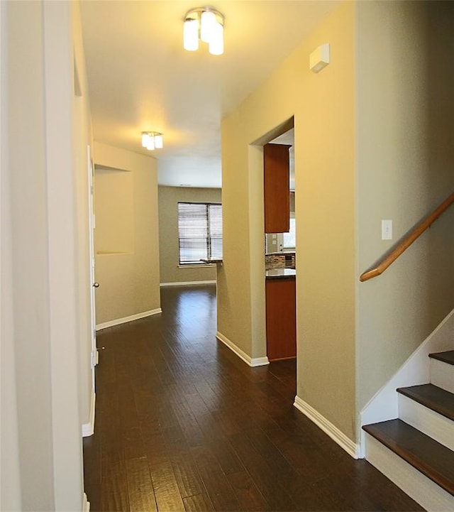 hall with dark wood-type flooring