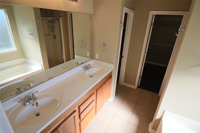 bathroom featuring tile patterned floors, separate shower and tub, and vanity