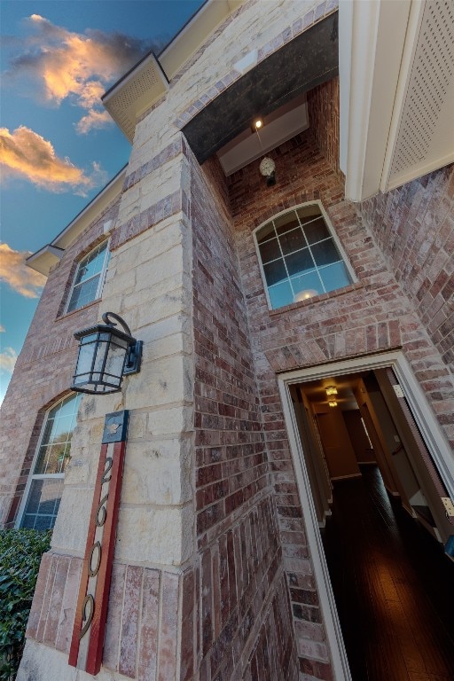 view of exterior entry at dusk