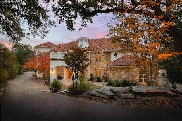 mediterranean / spanish-style home featuring a garage