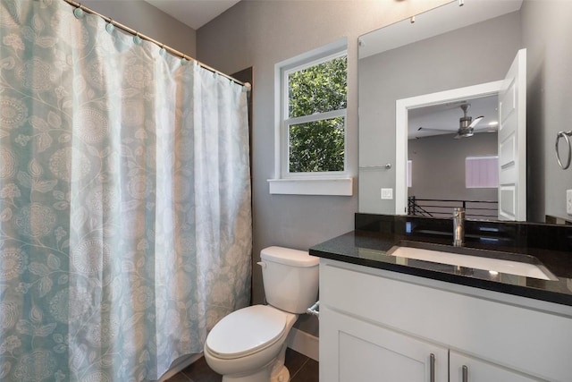 full bathroom with toilet, ceiling fan, and vanity