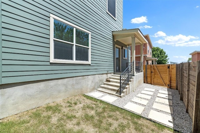 entrance to property with a gate and fence