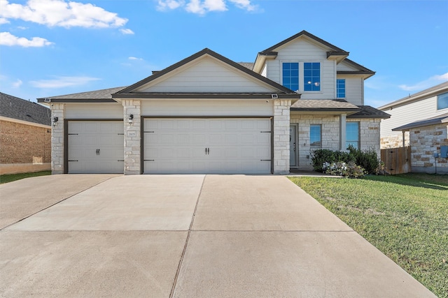 view of front of house with a front lawn and a garage