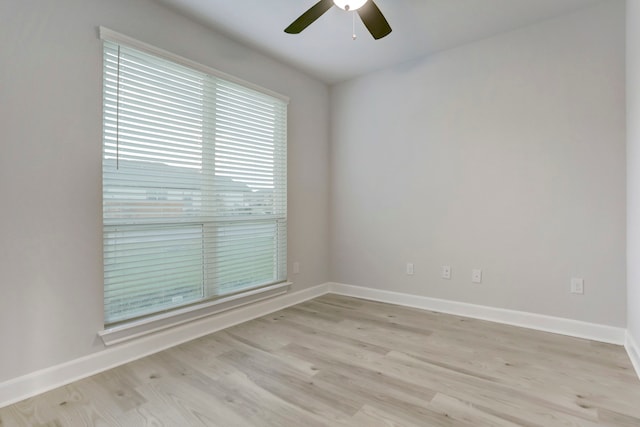 unfurnished room with light wood-type flooring and ceiling fan