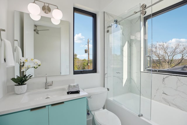 full bathroom with vanity, combined bath / shower with glass door, and toilet