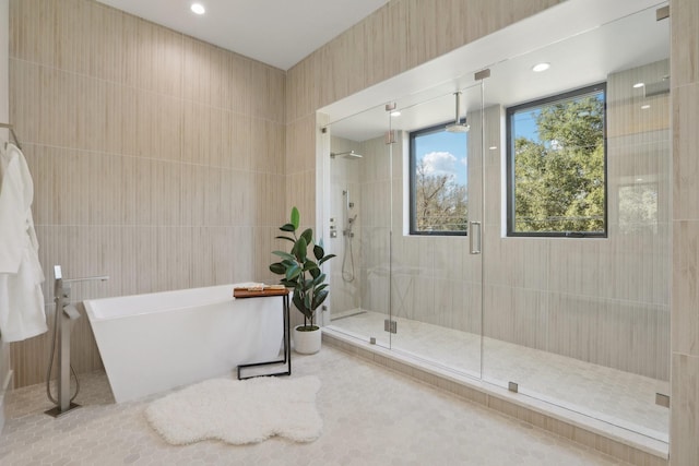 bathroom with separate shower and tub