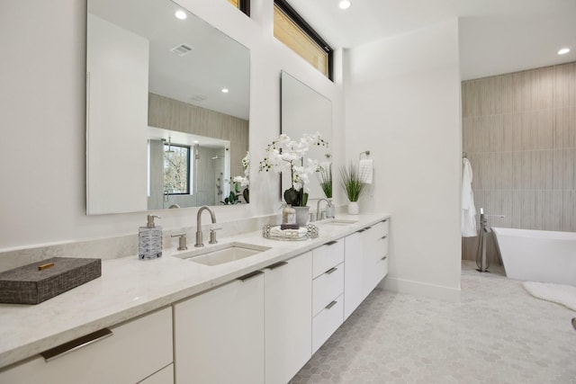 bathroom featuring tile patterned floors, vanity, and plus walk in shower