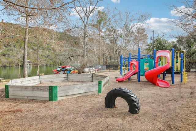 view of play area with a water view