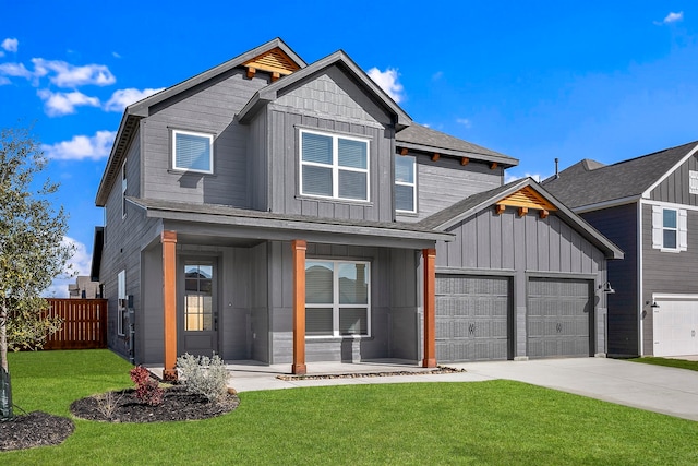 view of front of house with a porch, a garage, and a front yard