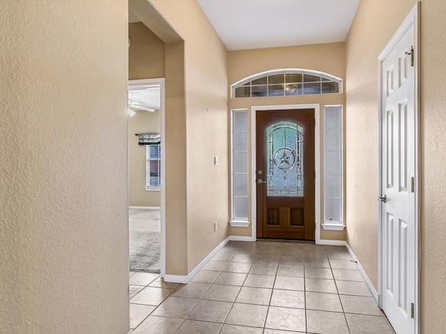 tiled entrance foyer with a wealth of natural light