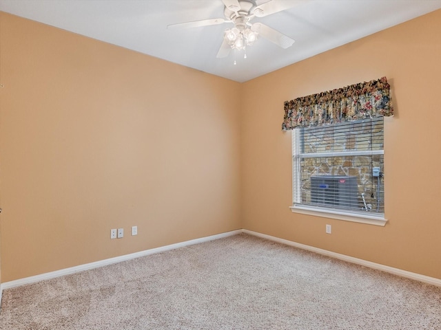 spare room with ceiling fan and carpet floors