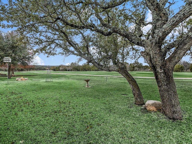 surrounding community with a lawn