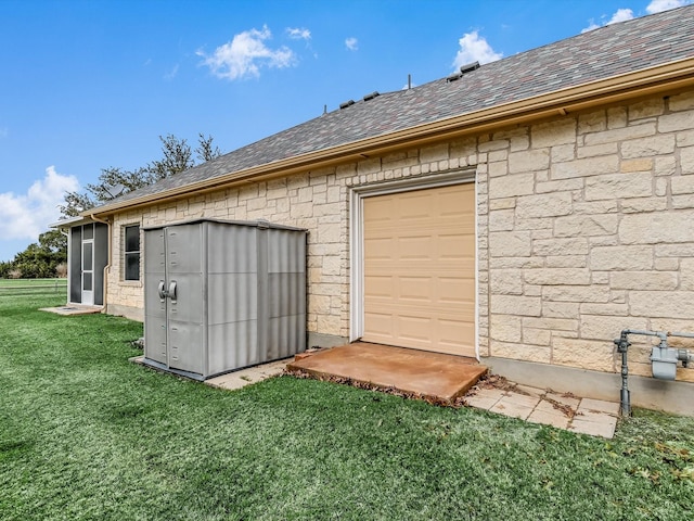 garage with a lawn