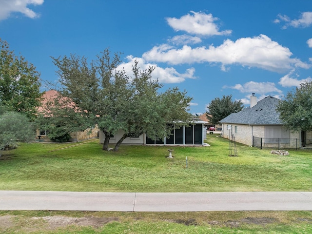 view of yard featuring a sunroom