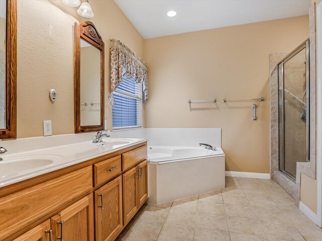 bathroom with tile patterned flooring, vanity, and separate shower and tub