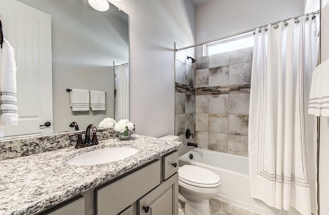 full bathroom featuring vanity, toilet, and shower / bath combo with shower curtain