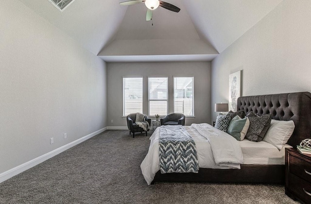 bedroom featuring dark colored carpet, vaulted ceiling, and ceiling fan