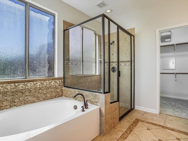 full bathroom with baseboards, visible vents, tile patterned flooring, and a shower stall