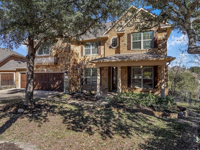 front facade with covered porch and a garage