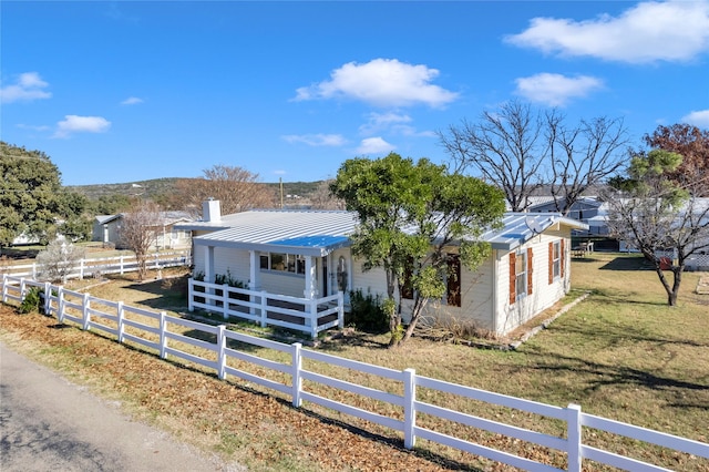 view of front of home with a front yard