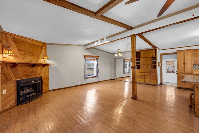 living room featuring lofted ceiling with beams, light hardwood / wood-style floors, ceiling fan, and crown molding