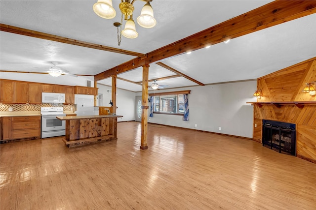 kitchen with light wood-type flooring, tasteful backsplash, white appliances, ceiling fan, and hanging light fixtures