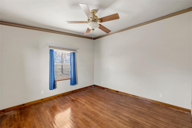 spare room featuring ceiling fan, wood-type flooring, and ornamental molding