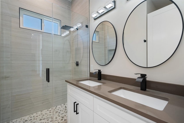 bathroom featuring vanity and an enclosed shower