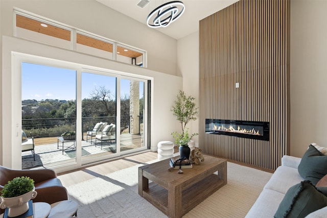 living room with a fireplace and light hardwood / wood-style flooring