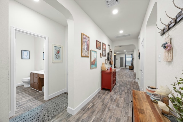 hall with dark hardwood / wood-style floors