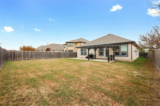 back of house featuring a pergola, a yard, and a patio