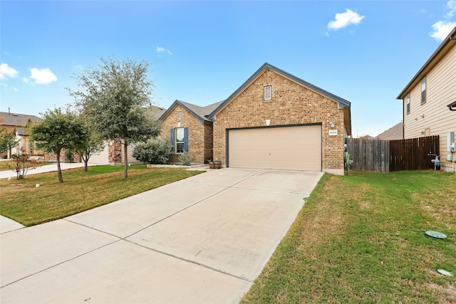 view of property featuring a garage and a front yard