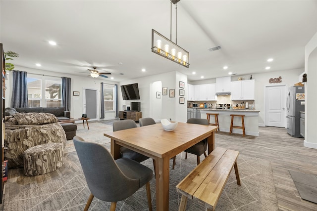 dining area featuring ceiling fan and light hardwood / wood-style floors