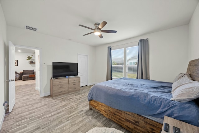 bedroom featuring light wood-type flooring and ceiling fan