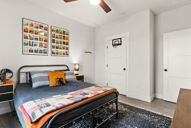 bedroom featuring ceiling fan and dark hardwood / wood-style floors