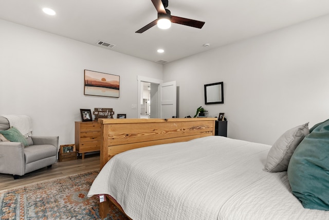 bedroom featuring hardwood / wood-style flooring and ceiling fan