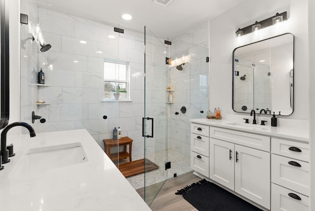 bathroom featuring vanity and walk in shower