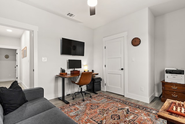 office area with wood-type flooring and ceiling fan