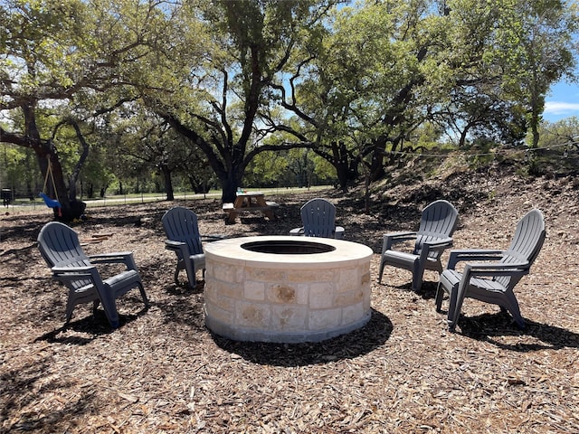 view of yard with a fire pit